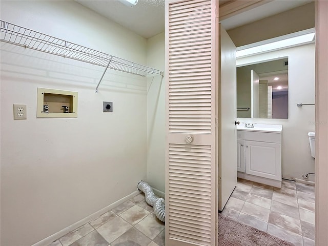 2587 Countryside Blvd Unit 6111, Clearwater, FL 33761 - clothes washing area featuring a sink, hookup for an electric dryer, baseboards, washer hookup, and light tile patterned floors