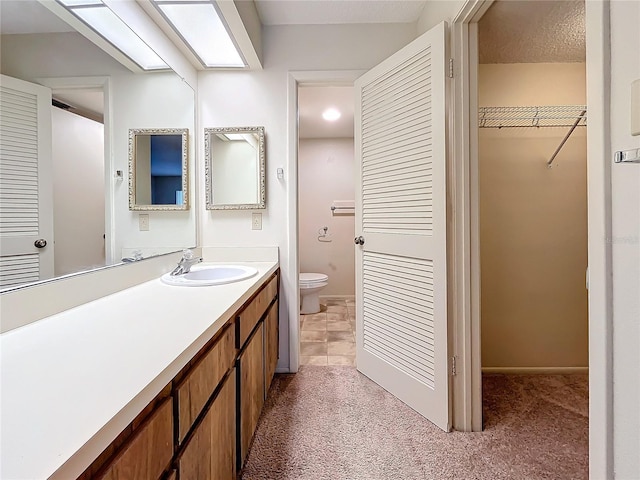 2587 Countryside Blvd Unit 6111, Clearwater, FL 33761 - full bathroom featuring vanity, a spacious closet, and toilet