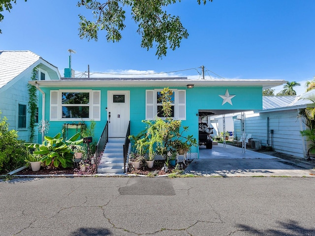 view of front of home featuring a carport