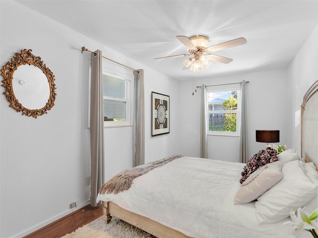 bedroom featuring ceiling fan and hardwood / wood-style floors