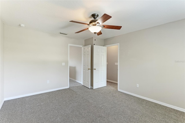 unfurnished bedroom with carpet flooring and ceiling fan