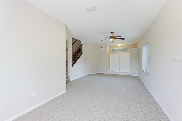 carpeted empty room with ceiling fan