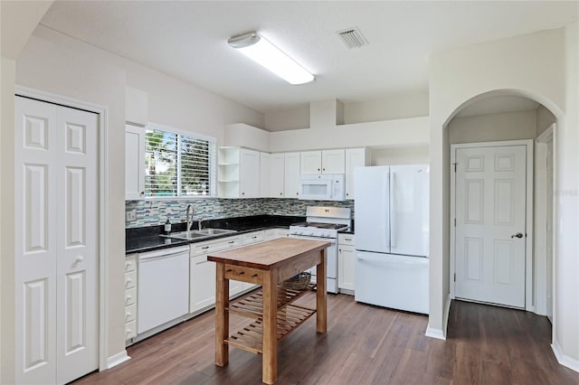 kitchen with white cabinets, white appliances, dark wood-type flooring, and sink