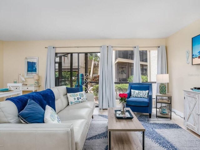 6157 Midnight Pass Rd Unit A51, Sarasota, FL 34242 - living area with baseboards and wood finished floors