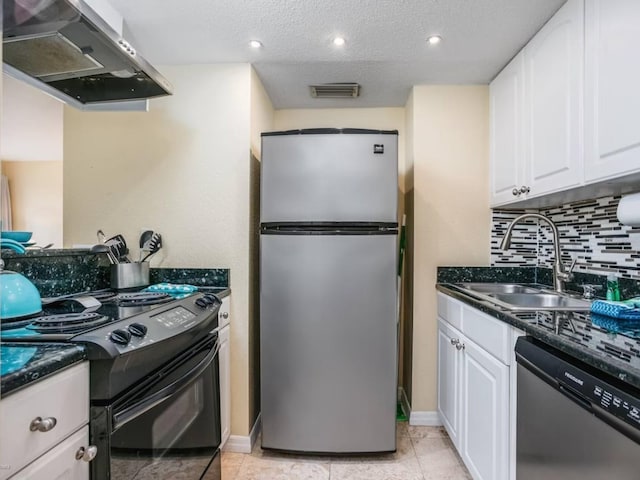 kitchen with white cabinetry, appliances with stainless steel finishes, sink, and extractor fan