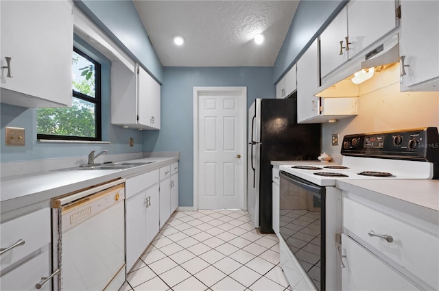 kitchen featuring a textured ceiling, sink, white cabinets, lofted ceiling, and white appliances