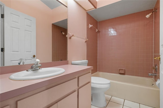 full bathroom with vanity, toilet, tile patterned floors, and tiled shower / bath