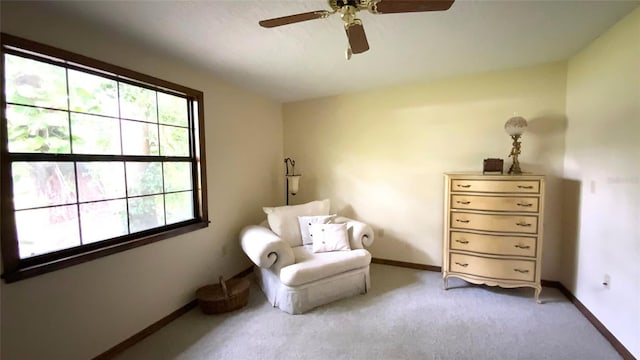 unfurnished room with a healthy amount of sunlight, light carpet, and ceiling fan