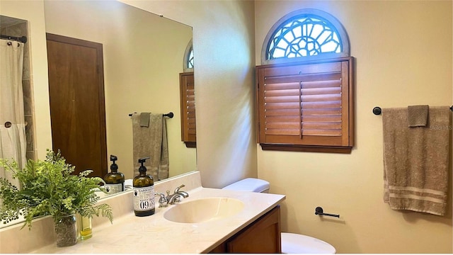 bathroom with vanity and toilet