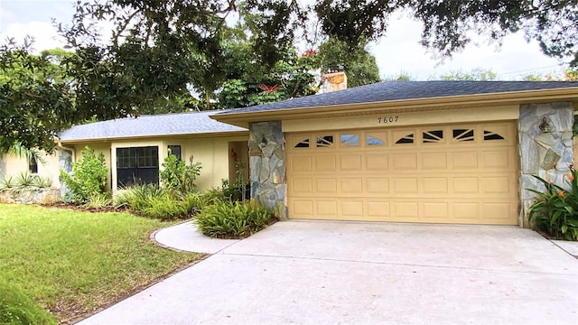 ranch-style house with a garage and a front lawn