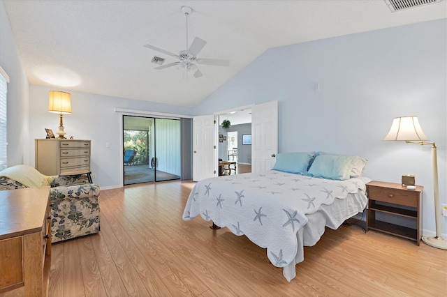 bedroom with access to outside, light hardwood / wood-style floors, lofted ceiling, and ceiling fan