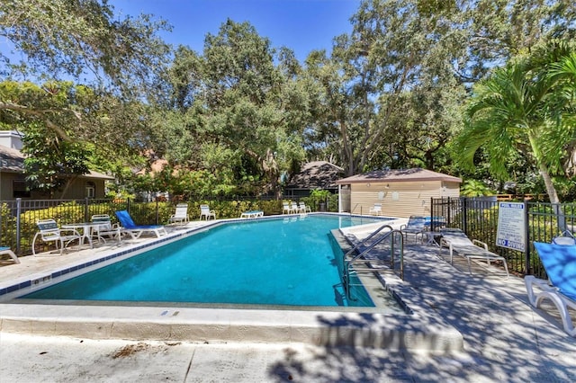 view of swimming pool with a patio area