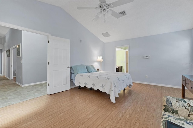 bedroom with light hardwood / wood-style floors, ceiling fan, and vaulted ceiling