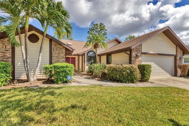 ranch-style house with a garage and a front yard