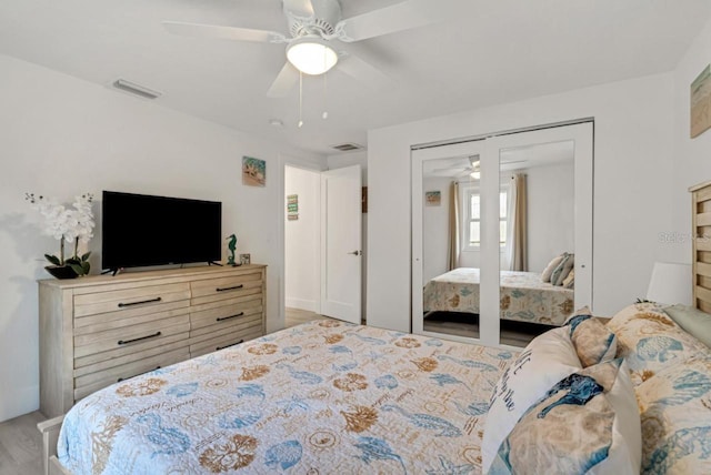 bedroom with visible vents, a closet, and a ceiling fan