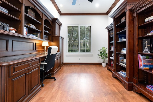 office with built in desk, crown molding, ceiling fan, and light hardwood / wood-style flooring