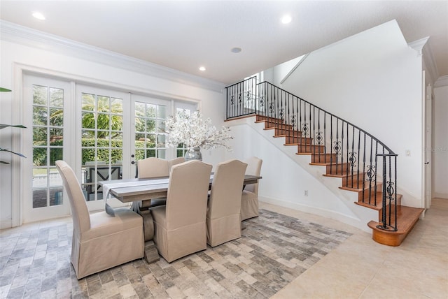 dining room with ornamental molding and french doors