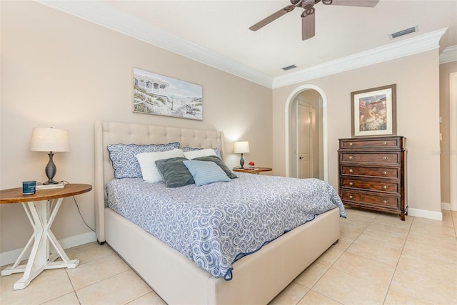 tiled bedroom featuring ornamental molding and ceiling fan