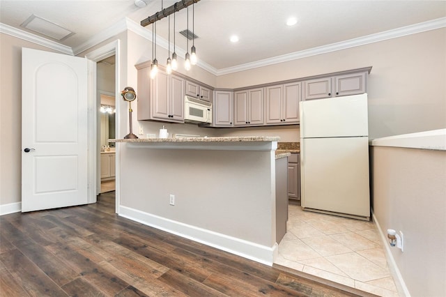 kitchen with ornamental molding, white appliances, gray cabinets, dark hardwood / wood-style floors, and light stone countertops