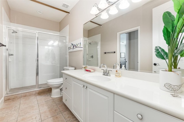 bathroom featuring vanity, toilet, tile patterned floors, and an enclosed shower