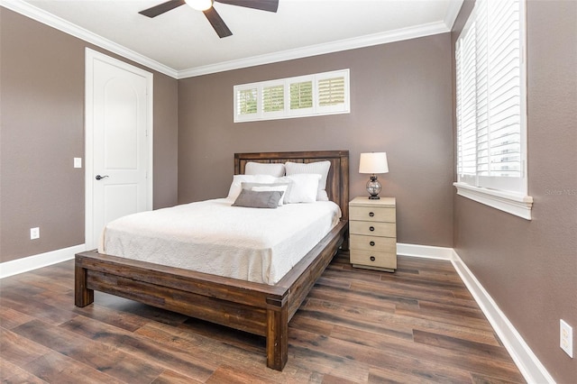 bedroom with multiple windows, ornamental molding, dark hardwood / wood-style flooring, and ceiling fan