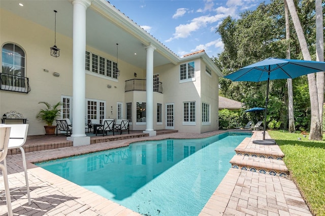 view of swimming pool with a patio