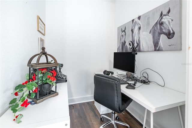 home office with dark wood-type flooring