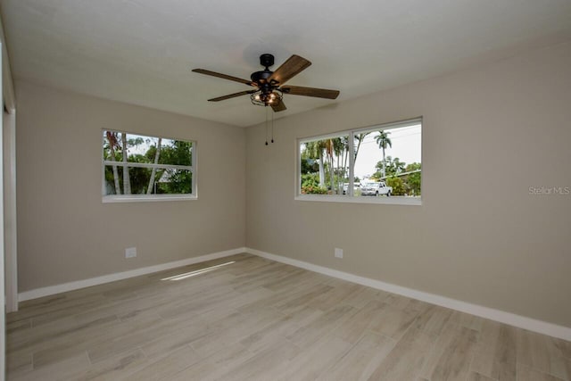 empty room featuring light hardwood / wood-style floors and ceiling fan