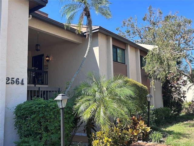 view of side of property with a balcony