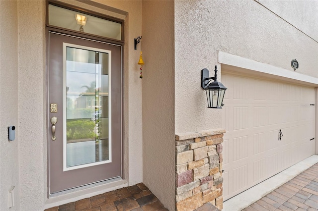 property entrance with a garage