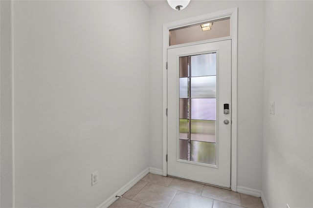 doorway to outside featuring light tile patterned flooring