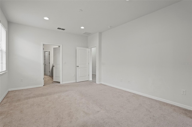 unfurnished bedroom with light carpet