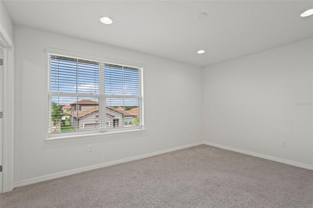 unfurnished room with carpet floors