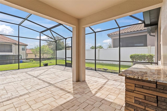 view of patio with a lanai