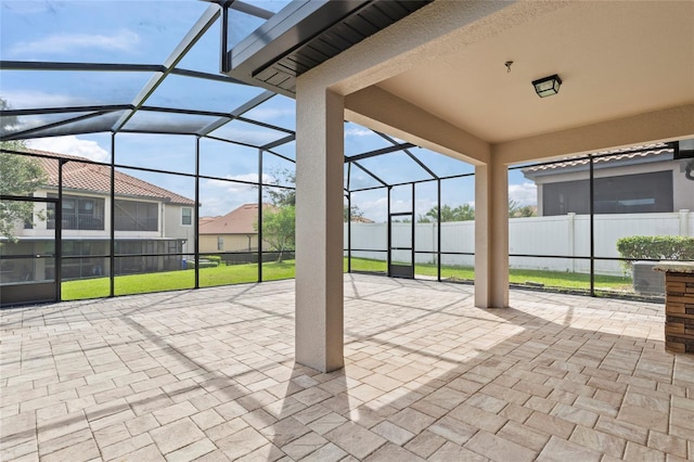 view of patio with glass enclosure