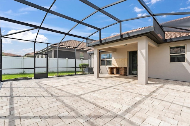 view of patio / terrace featuring a lanai