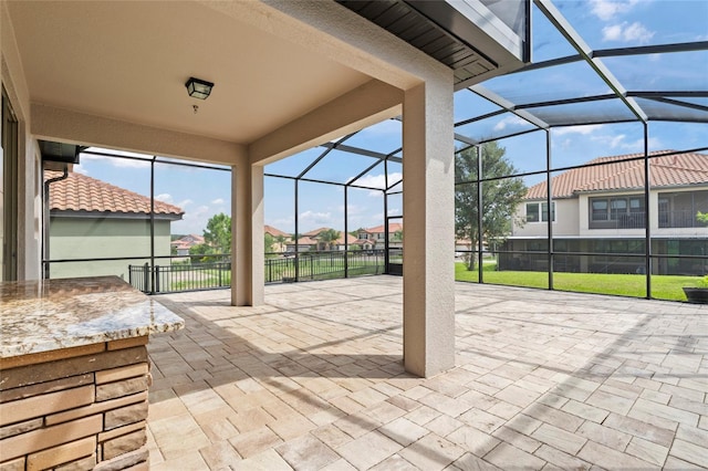 view of patio / terrace with a lanai