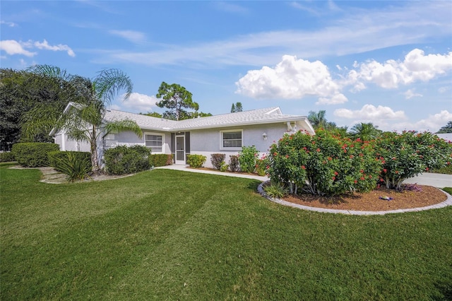 3653 Bonaventure Ct, Sarasota, FL 34243 - ranch-style house featuring stucco siding and a front yard