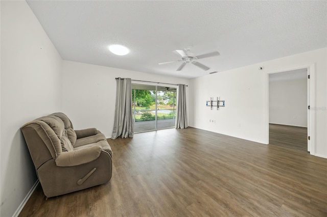 3653 Bonaventure Ct, Sarasota, FL 34243 - sitting room with ceiling fan and wood finished floors