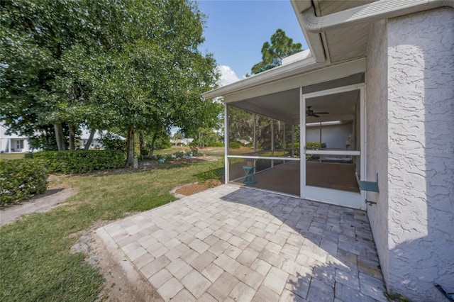 3653 Bonaventure Ct, Sarasota, FL 34243 - view of patio / terrace with a sunroom and a ceiling fan