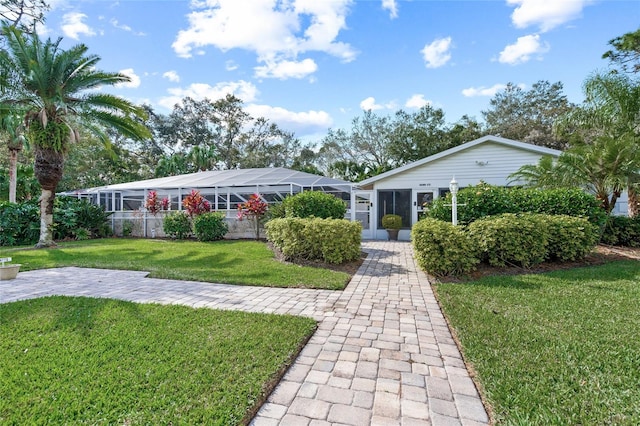 single story home featuring a front yard and a lanai