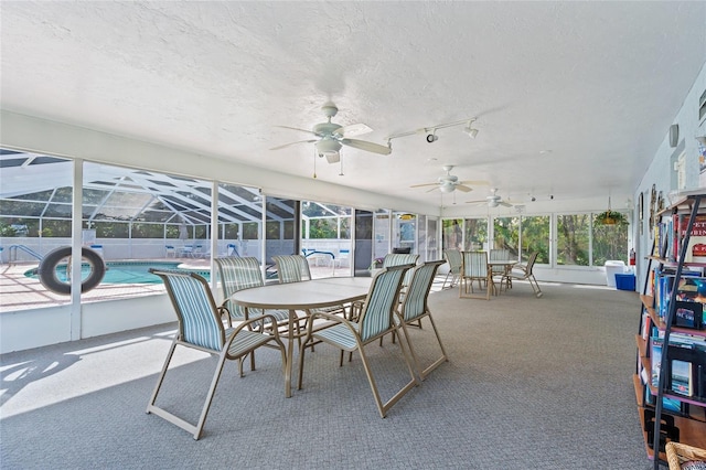 3653 Bonaventure Ct, Sarasota, FL 34243 - sunroom featuring a ceiling fan, healthy amount of natural light, and outdoor dining space