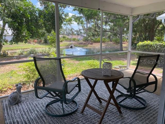 3653 Bonaventure Ct, Sarasota, FL 34243 - sunroom / solarium with a water view