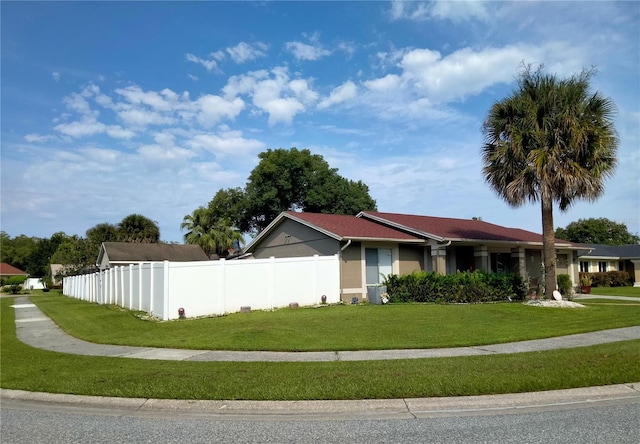 view of home's exterior with a yard