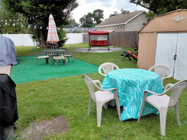 view of yard with a patio and a shed