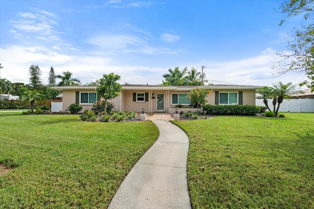 ranch-style house featuring a front lawn