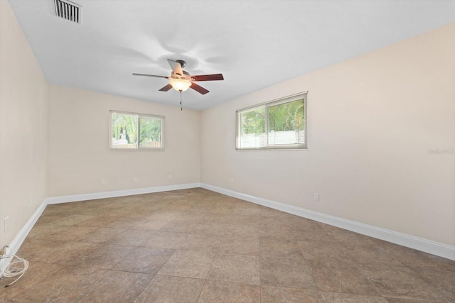 unfurnished room with ceiling fan