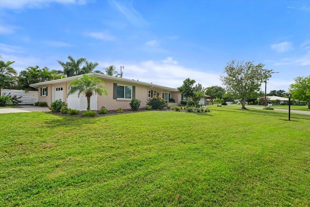 single story home with a front lawn and a garage