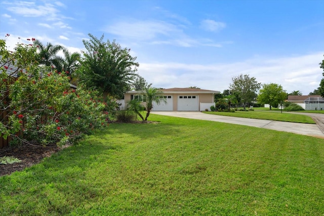 view of front of home featuring a front yard and a garage