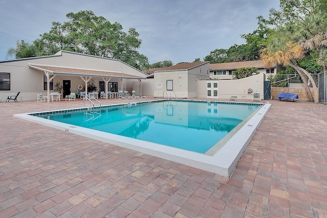 view of swimming pool with a patio area